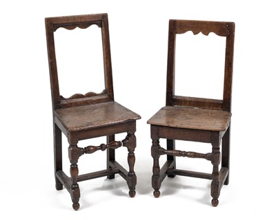 Lot 351 - A near pair of 18th/19th century oak Alsatian joint stools