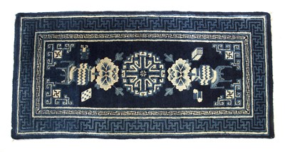 Lot 275 - Blue ground rug Chinese with a central...