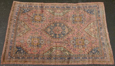 Lot 528 - An early 20th century woollen hand-woven Oushak carpet