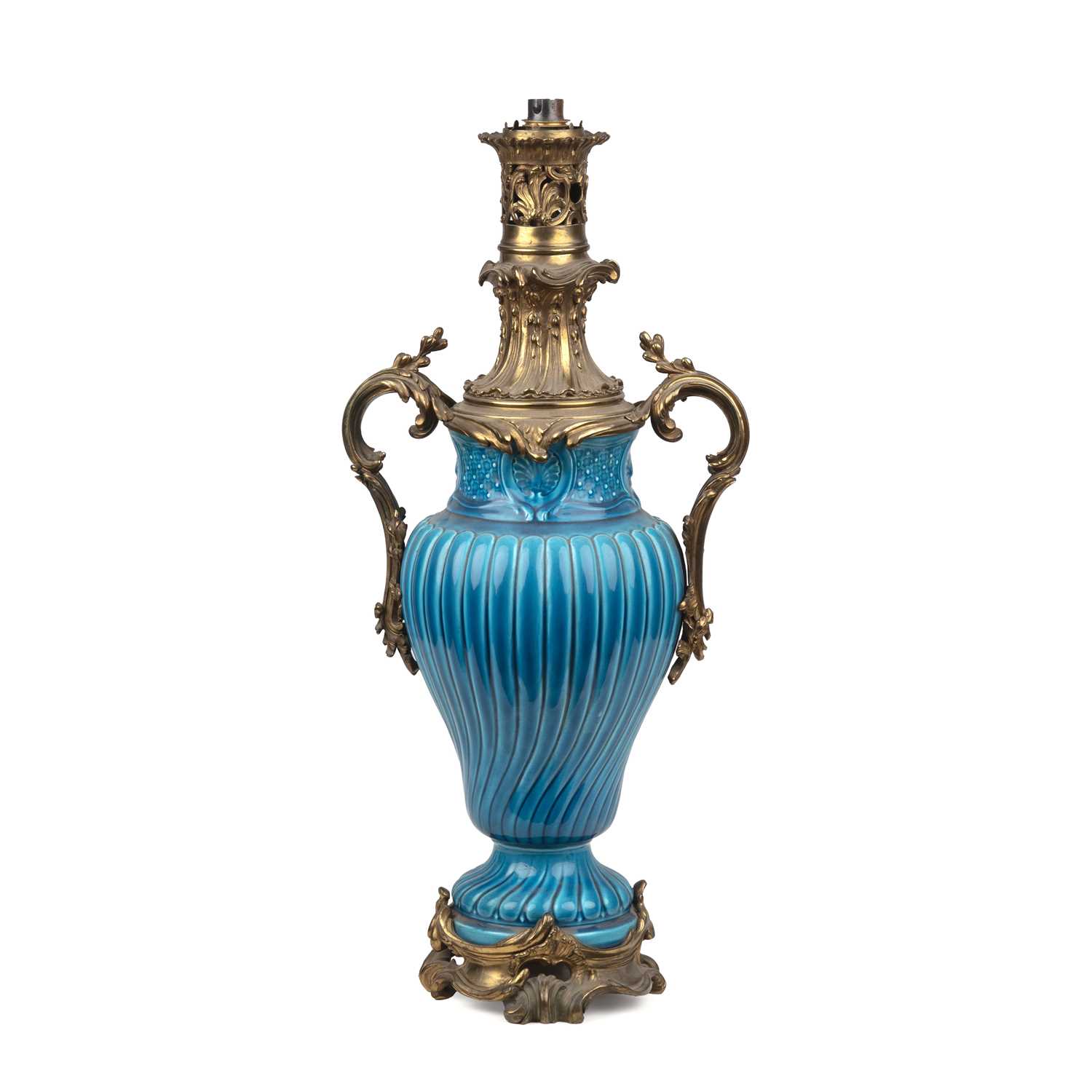 Lot 146 - A French faience turquoise oil lamp with...