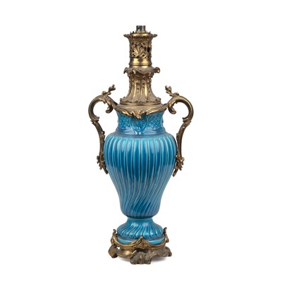 Lot 146 - A French faience turquoise oil lamp with...