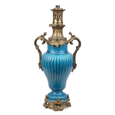Lot 146 - A French faience turquoise oil lamp with...