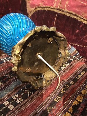 Lot 146 - A French faience turquoise oil lamp with...