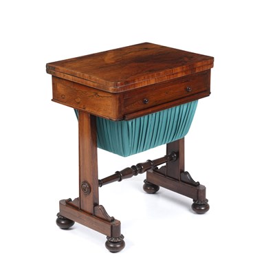 Lot 83 - A Regency rosewood work table having a green...