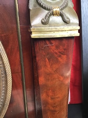 Lot 128 - A 19th century French empire mahogany commode...