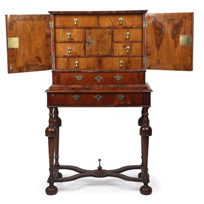 Lot 143 - A Queen Anne and later walnut cabinet on a...
