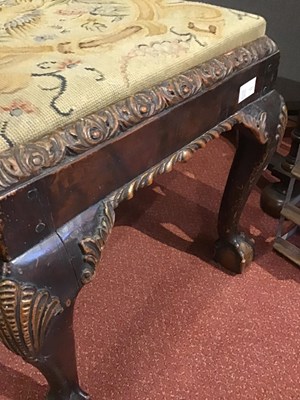 Lot 165 - An 18th century walnut stool with tapestry...