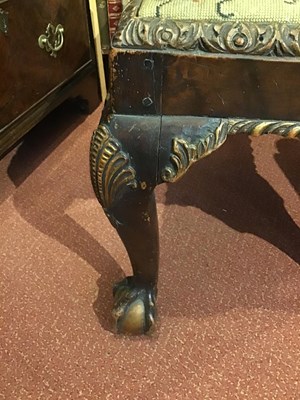 Lot 165 - An 18th century walnut stool with tapestry...