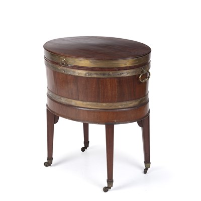 Lot 173 - A George III mahogany oval cellarette with a...