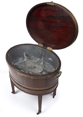 Lot 173 - A George III mahogany oval cellarette with a...