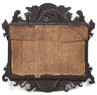 Lot 152 - A Georgian walnut fret framed wall mirror with...