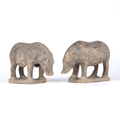 Lot 209 - A pair of Chinese terracotta boar in the Tang...