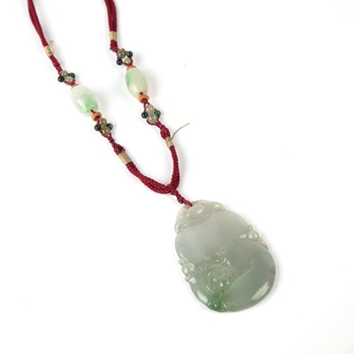 Lot 175 - Carved jade pendant  Chinese, carved in the...