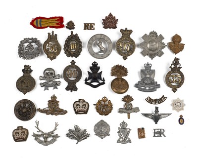 Lot 34 - A collection of various military cap badges