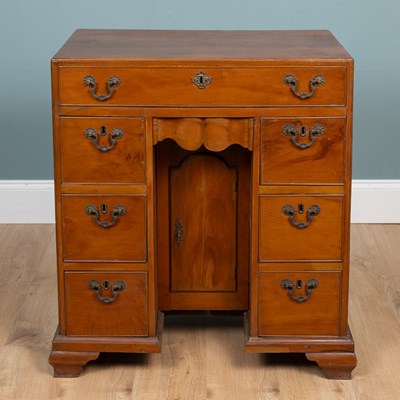 Lot 57 - A late 19th/early 20th century fruitwood caddy-topped kneehole desk