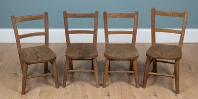 Lot 98 - A group of four ash and elm children's Windsor type chairs