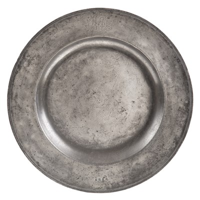 Lot 25 - A 17th century pewter broad rim charger by...