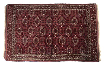 Lot 276 - A Yomut Turkmen rug with 'turreted' gul design,...