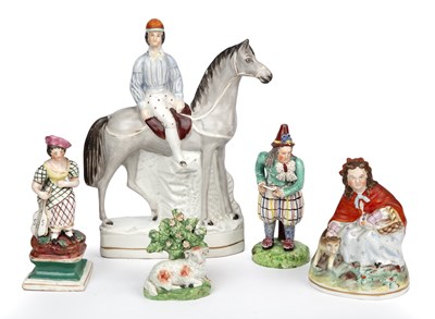 Lot 386 - A group of Staffordshire figurines to include...