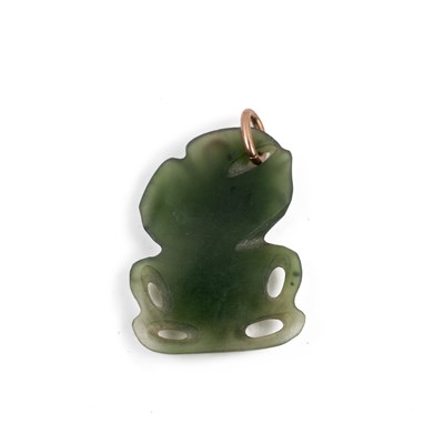 Lot 422 - A Maori nephrite jade tiki pendant, the...