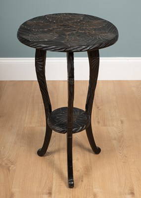 Lot 250 - An early 20th century Liberty & Co carved wood occasional table