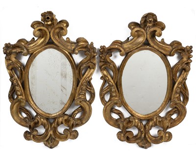 Lot 437 - A pair of Venetian-style carved gilt wood wall mirrors