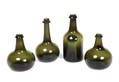 Lot 236 - Four reproduction English green glass bottles...