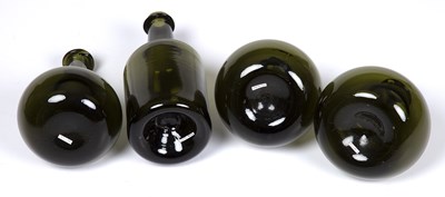 Lot 236 - Four reproduction English green glass bottles...