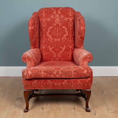 Lot 279 - A George III-style wingback armchair