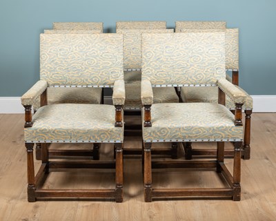 Lot 1065 - A set of fourteen French 18th century-style oak dining chairs
