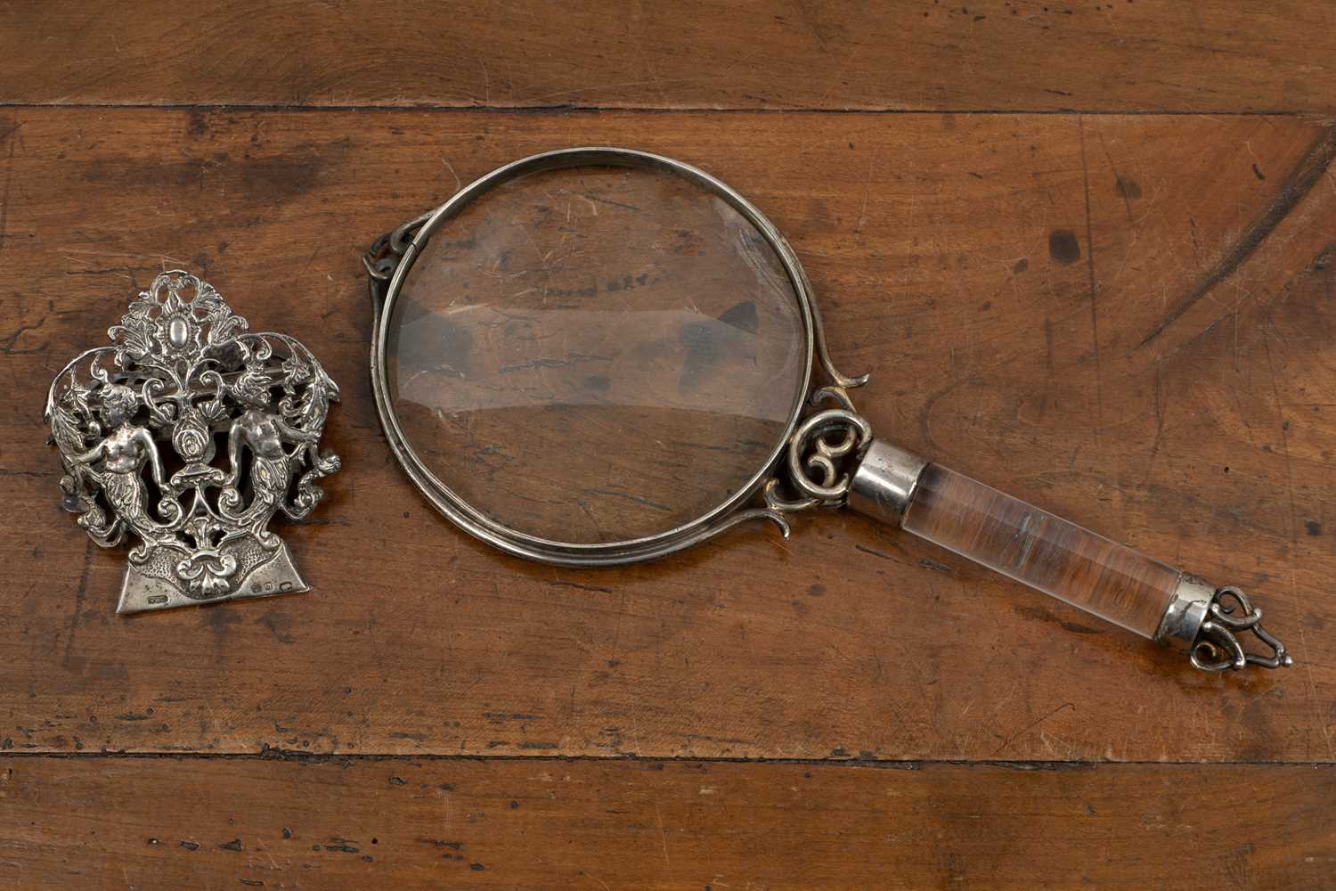 Lot 301 - A silver mounted magnifying glass by Charles & George Asprey c1894, together with a silver desk clip
