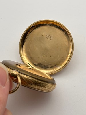 Lot 281 - An open face fob watch, the floral and foliate...