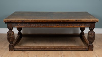 Lot 1079 - An early 20th century large oak dining table