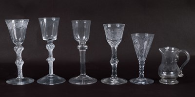 Lot 243 - A group of five antique glasses and a small glass jug