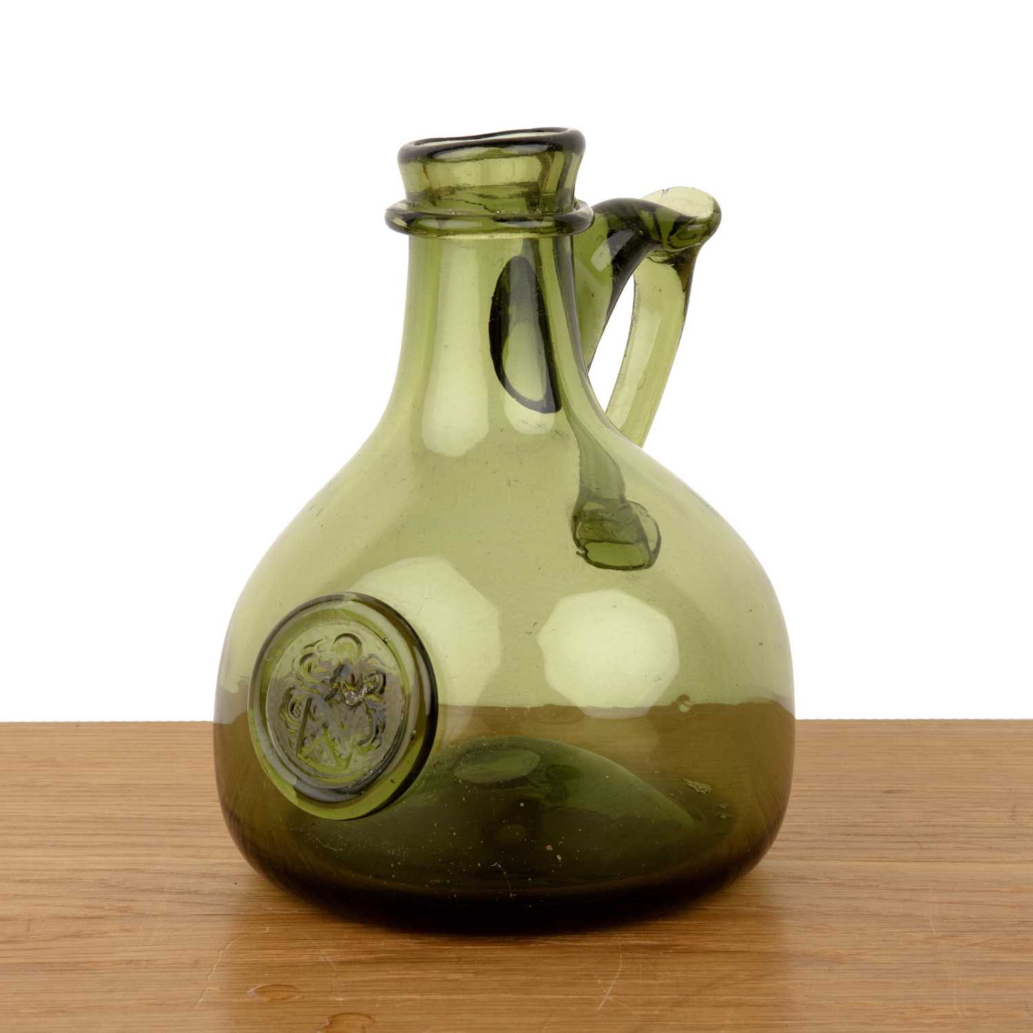 Lot 316 - Green glass seal jug 18th Century, with a...