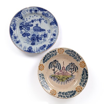 Lot 369 - An 18th century Delft blue and white charger...