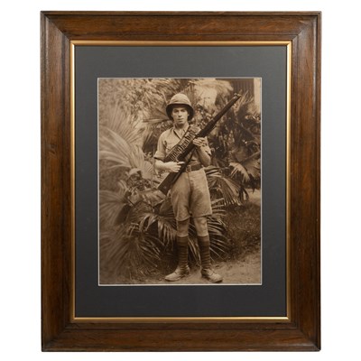 Lot 177 - An early 20th century large sepia photograph of a colonial British soldier