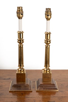 Lot 102 - Two brass table lamps and two 19th century brass candlesticks