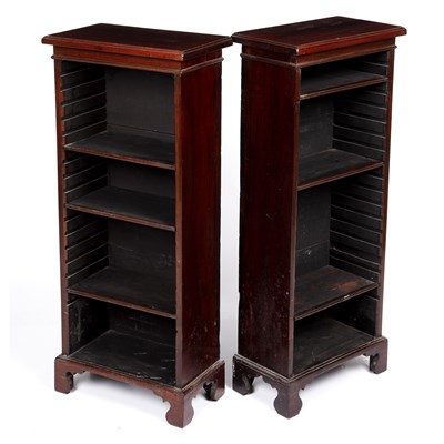Lot 85 - A pair of small narrow rosewood bookcases with...