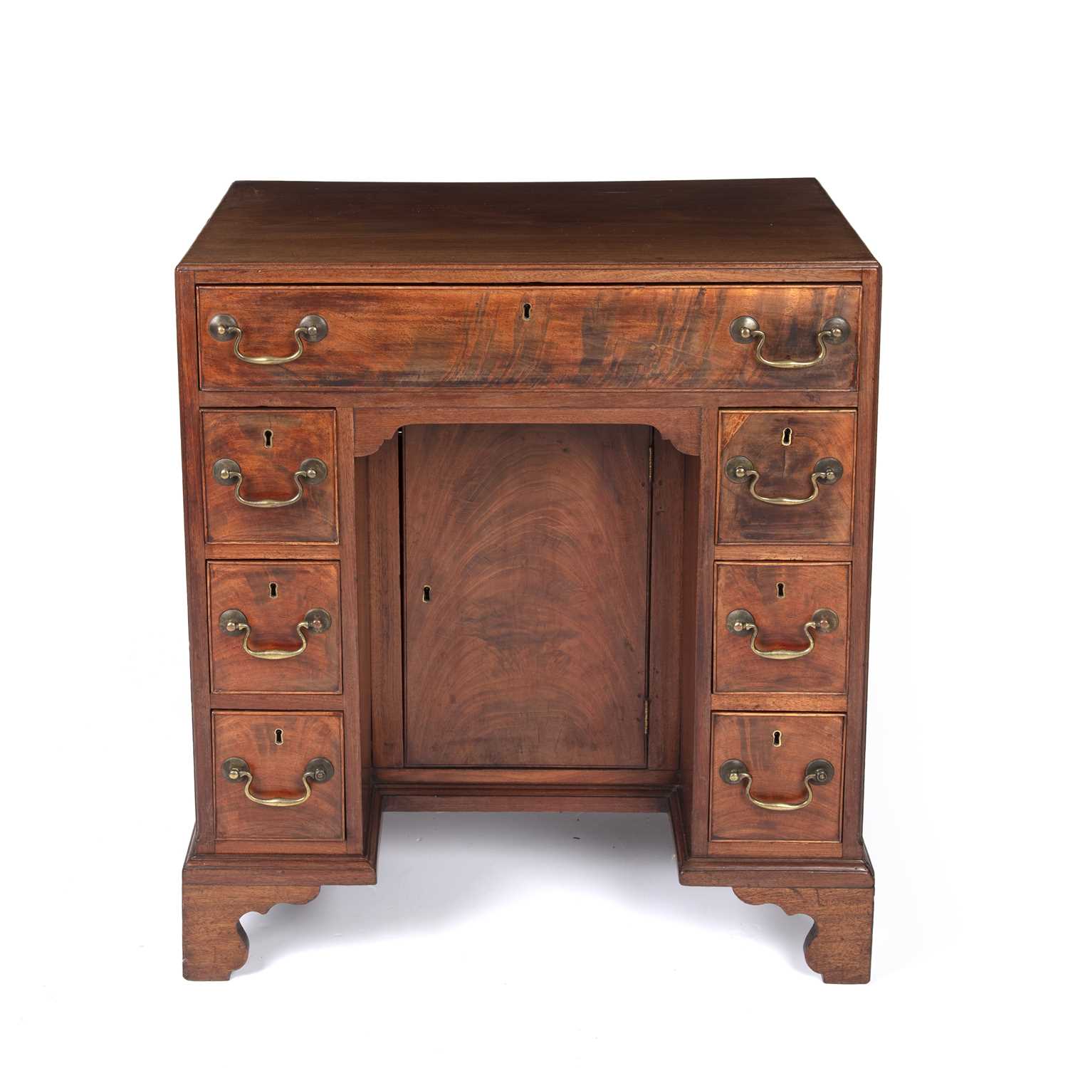 Lot 84 - A George III mahogany kneehole desk with a...