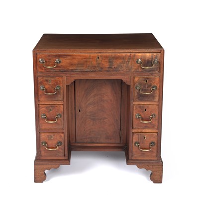 Lot 84 - A George III mahogany kneehole desk with a...