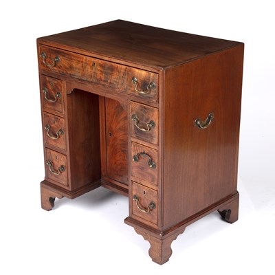 Lot 84 - A George III mahogany kneehole desk with a...