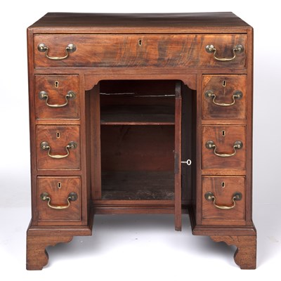 Lot 84 - A George III mahogany kneehole desk with a...