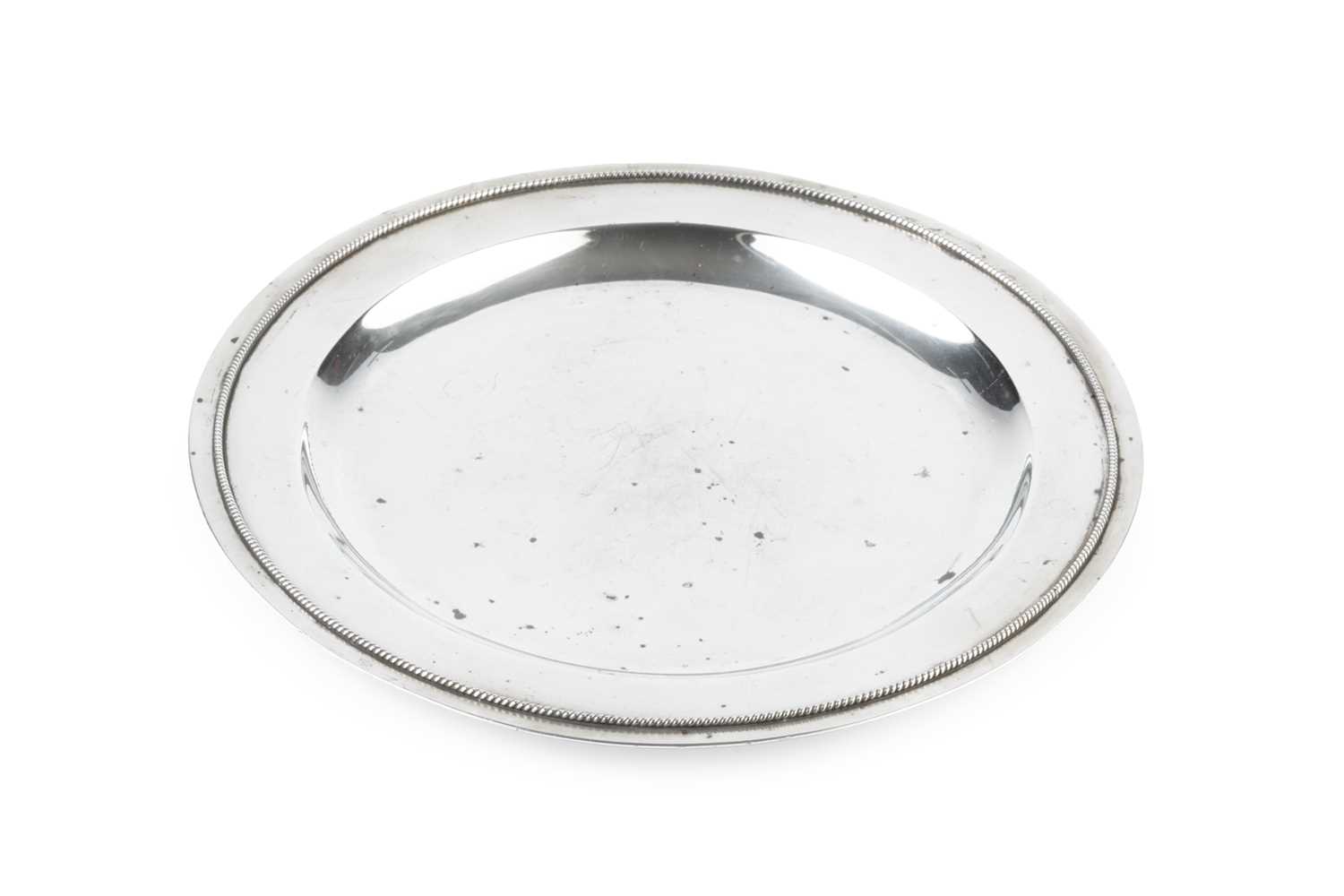 Lot 469 - A George V silver Arts & Crafts circular plate,...