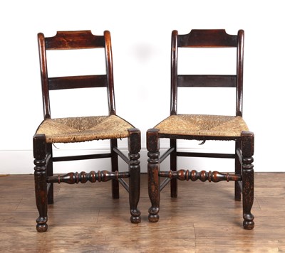 Lot 50 - Pair of oak and fruitwood rush seat chairs...