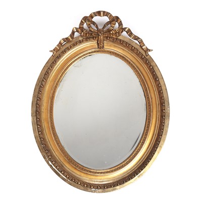 Lot 54 - Gilt oval wall mirror circa 1920, with ribbon...