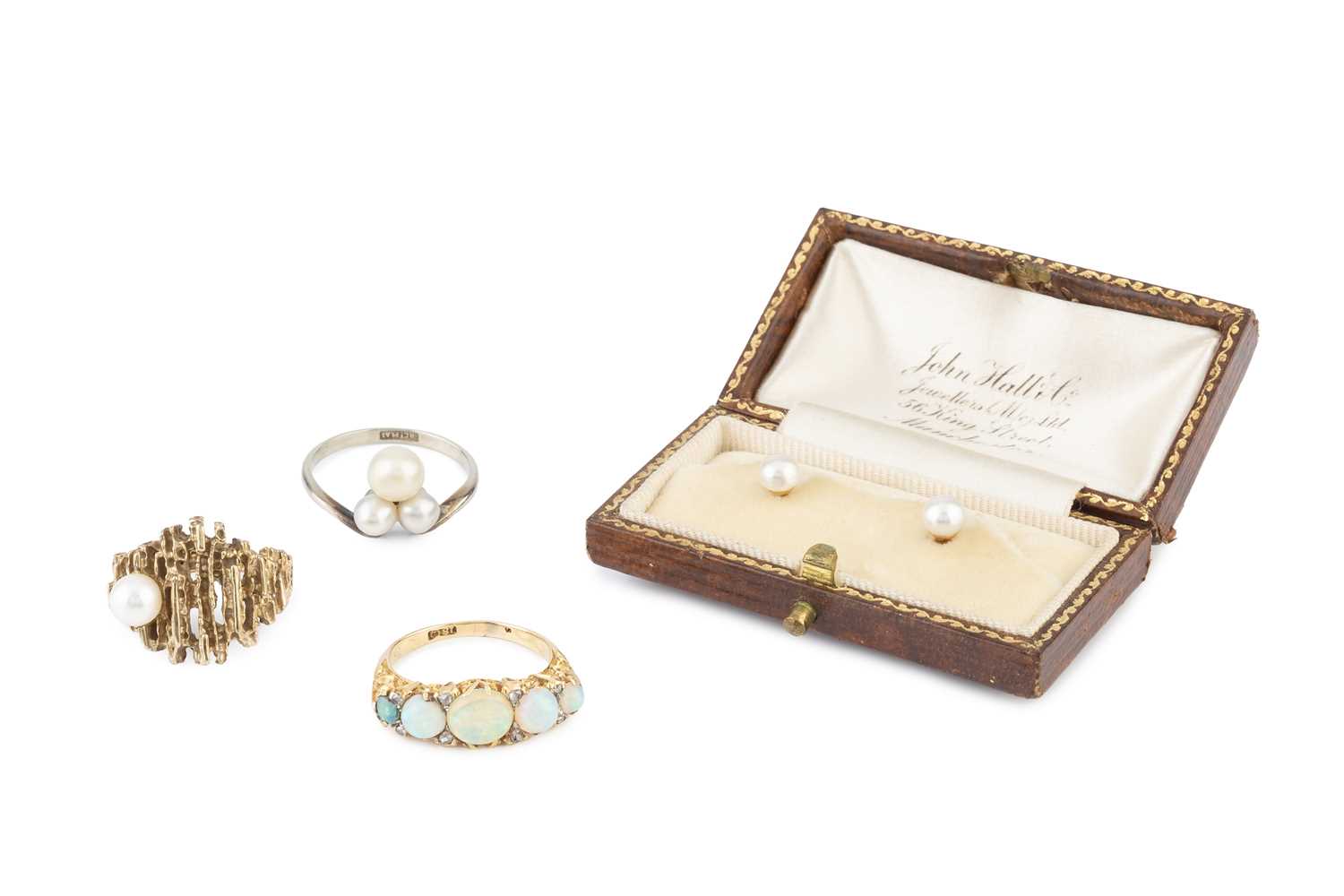 Lot 87 - An opal and diamond half hoop ring, the...