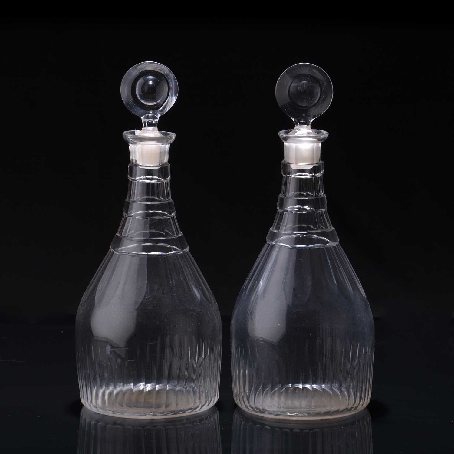 Lot 324 - Pair of glass decanters circa 1810, with cut...