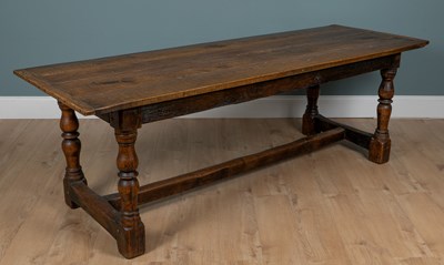 Lot 1004 - A 19th century oak refectory-style table
