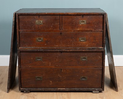 Lot 112 - A 19th-century mahogany campaign chest unusual removable drawer covers